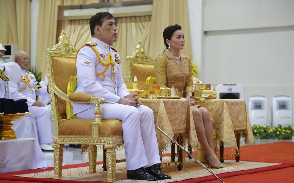 This photo taken on September 24, 2020 shows Thailand's King Maha Vajiralongkorn (C) and Queen Suthida (R) attending an event at Siriraj Hospital in Bangkok.  -  STR / AFP