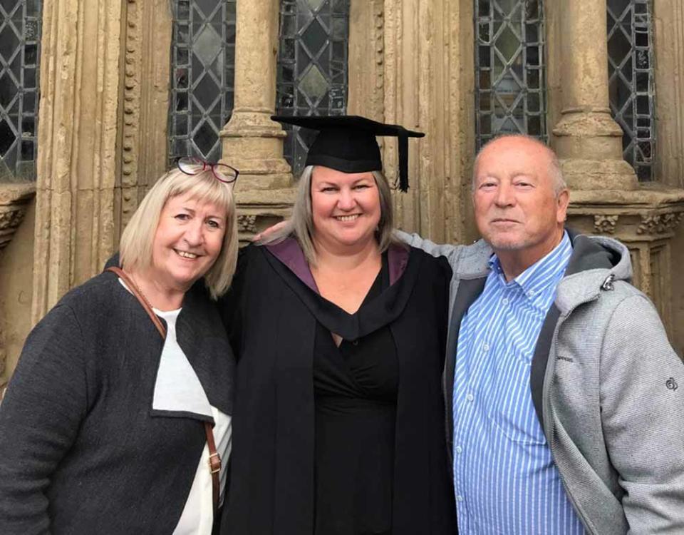 Angelique with her parents, Bernadette and Alan, after graduating (Collect/PA Real Life).