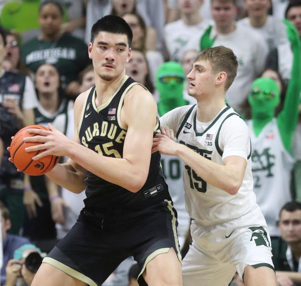Michigan State Spartans center Carson Cooper (15) defends Purdue Boilermakers center Zach Edey (15) during the second half Monday, Jan. 16, 2023 at Breslin Center in East Lansing.