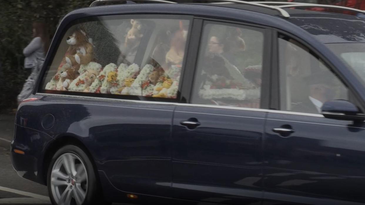 A hearse passes during the funeral procession for Azaylia Cain (PA Video)