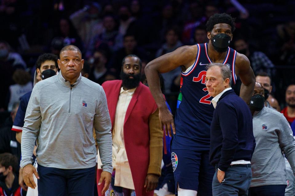 Can Joel Embiid (center right) team with James Harden (center left) to win a title for 76ers coach Doc Rivers (left) and team owner Joshua Harris (right)?