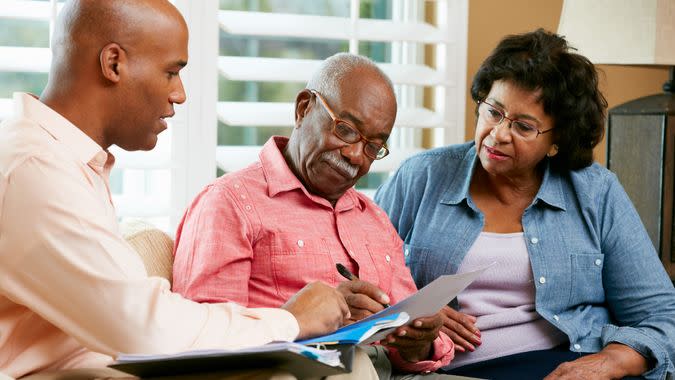 Financial Advisor Talking To Senior Couple.