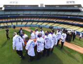 In this photo provided by the Los Angeles Dodgers, the casket of Hall of Fame manager Tommy Lasorda is carried during a ceremony at Dodger Stadium, Tuesday, Jan. 19, 2021, in Los Angeles. (Jon SooHoo/Los Angeles Dodgers via AP)