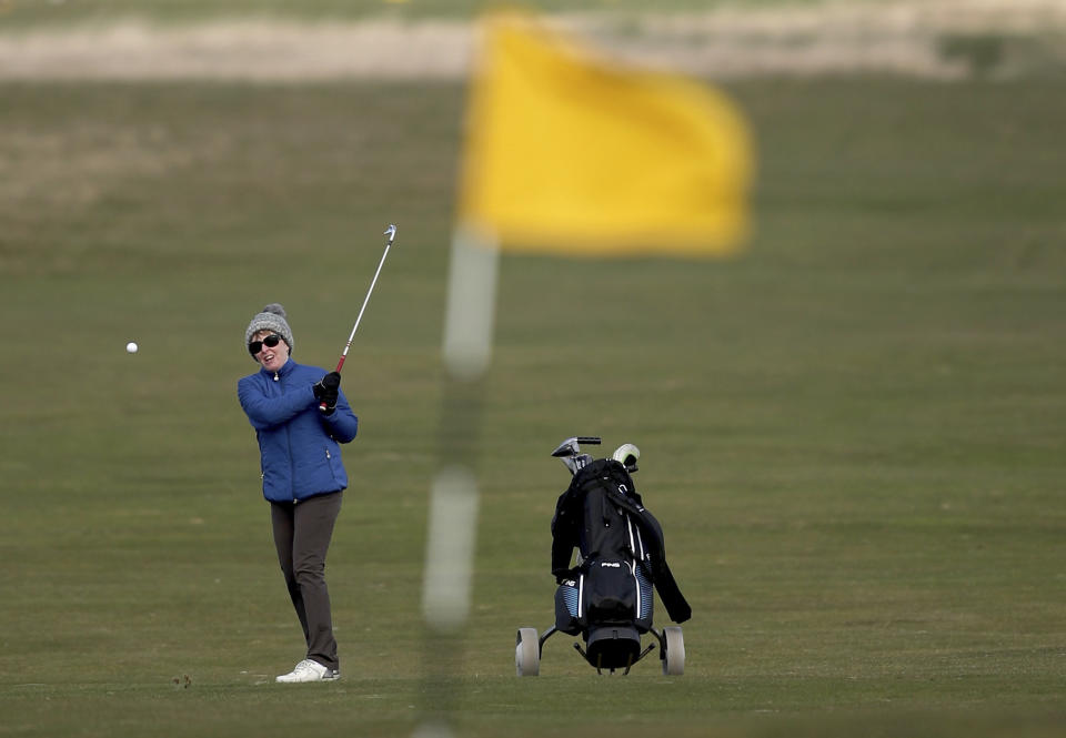 Woman golfer Jeanette Siehenthiler plays on the 18th hole after it was announced that women will be admitted as members of Muirfield Golf Club after a membership ballot was held by The Honourable Company of Edinburgh Golfers, in Gullane, Scotland Tuesday, March 14, 2017.