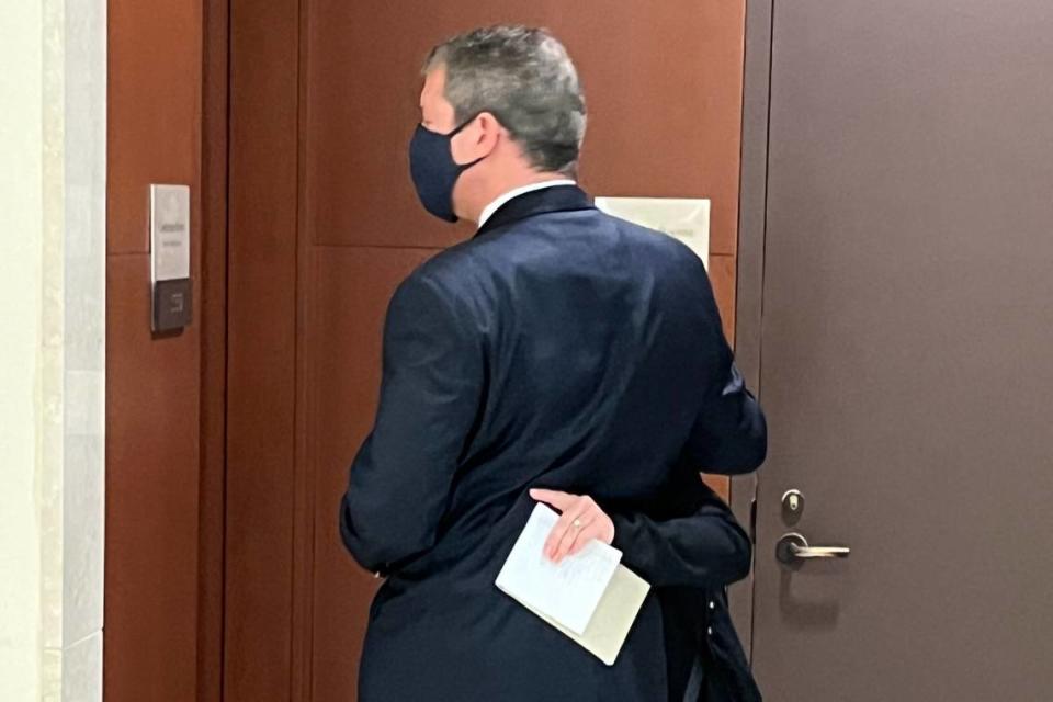 Evan Roy Wilkoff, a former president of Temple Beth El, hugs his wife inside the Mecklenburg County courthouse on Monday after pleading guilty to a child pornography charge.