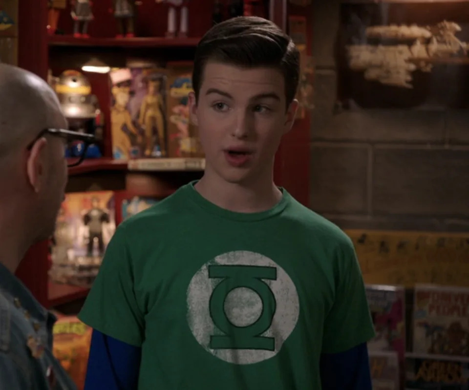 teenage Sheldon wearing a Green Lantern shirt