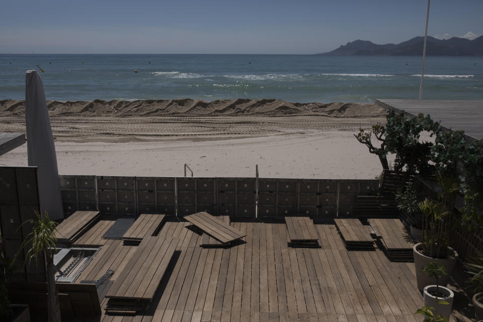 A deserted terrace on the Croisette beach is pictured empty due to measures put in place to stop the spread of the coronavirus in Cannes, southern France, Tuesday, May 12, 2020. The Cannes Film Festival won't kick off as planned on Tuesday. The festival's 73rd edition has been postponed indefinitely, part of the worldwide shutdowns meant to stop the spread of the coronavirus. (AP Photo/Daniel Cole)