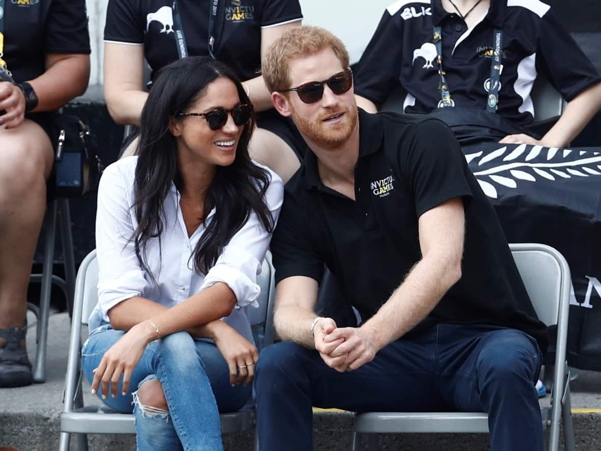 Britain's Prince Harry sits with Meghan Markle to watch a wheelchair tennis event during the Invictus Games in Toronto, Ontario, Canada September 25, 2017.    (Mark Blinch/Reuters - image credit)