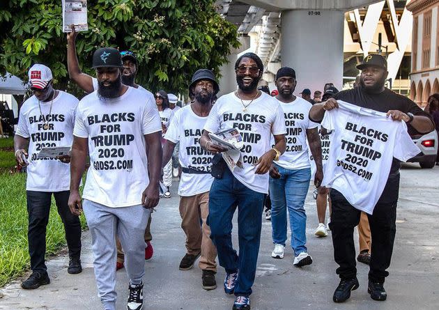 Members of Blacks for Trump, led by Maurice Symonette (center), march at the Miami Federal Courthouse before an appearance by former President Donald Trump on June 13, 2023, in the classified documents case.