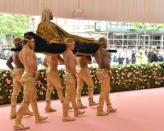 US actor Billy Porter was carried into the Met Gala on a litter