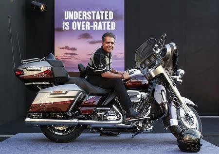 Anoop Prakash, Managing Director of Harley-Davidson India, poses on a CVO Limited motorcycle at its launching ceremony in Mumbai October 30, 2014. REUTERS/Danish Siddiqui