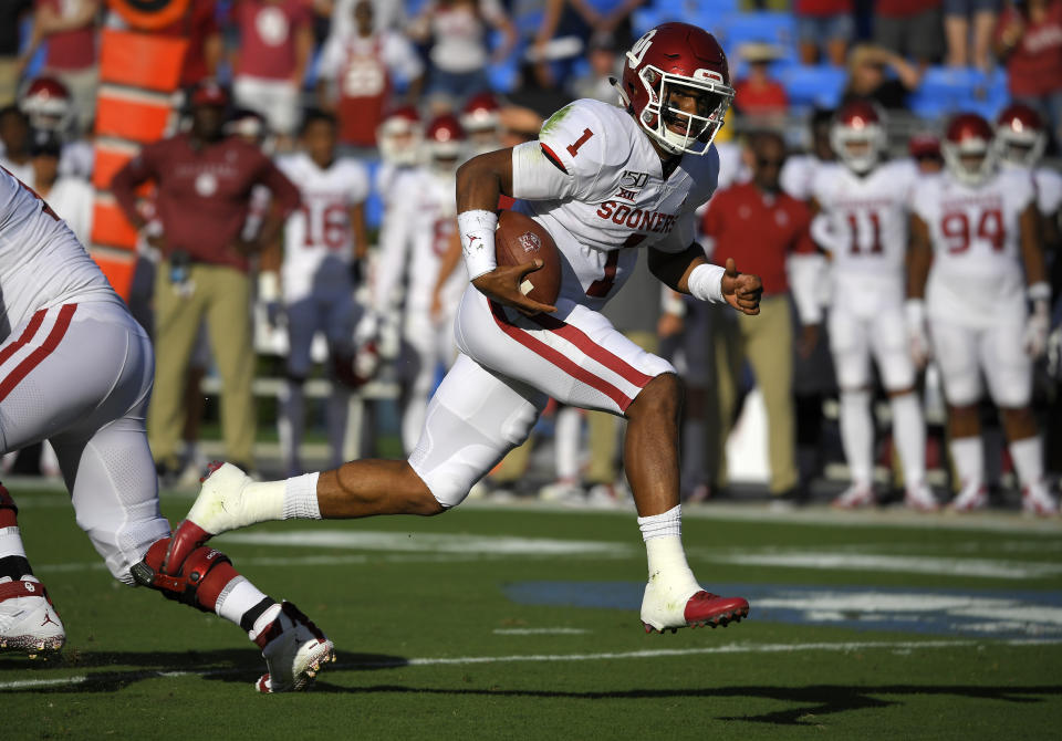 Oklahoma quarterback Jalen Hurts runs in for a touchdown during the first half of the team's NCAA college football game against UCLA on Saturday, Sept. 14, 2019, in Pasadena, Calif. (AP Photo/Mark J. Terrill)