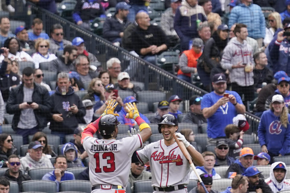Atlanta Braves' Ronald Acuna Jr., left, celebrates his home run with Matt Olson during the second inning of the first baseball game of a doubleheader against the New York Mets at Citi Field, Monday, May 1, 2023, in New York. (AP Photo/Seth Wenig)