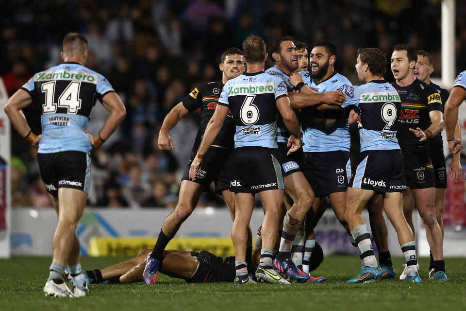 Panthers players, pictured here taking exception to Dale Finucane's hit on Stephen Crichton.