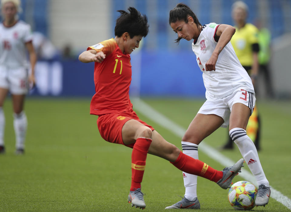 China's Wang Shanshan, left, vies for control of the ball against Spain's Leila Ouahabi during the Women's World Cup Group B soccer match between China and Spain at the Stade Oceane in Le Havre, France, Monday, June 17, 2019. (AP Photo/Francisco Seco)