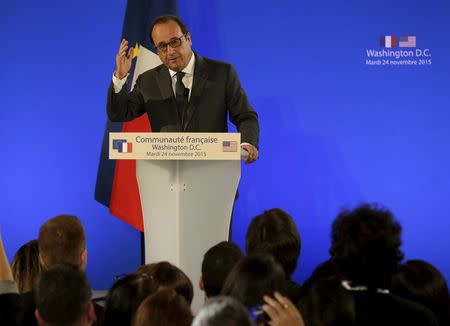 French President Francois Hollande delivers remarks to members of the French community during a reception at the French embassy in Washington, November 24, 2015. REUTERS/Gary Cameron