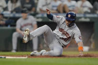 Houston Astros' Aledmys Diaz scores on a single by Jake Meyers during the sixth inning of the team's baseball game against the Seattle Mariners, Friday, July 22, 2022, in Seattle. (AP Photo/Ted S. Warren)