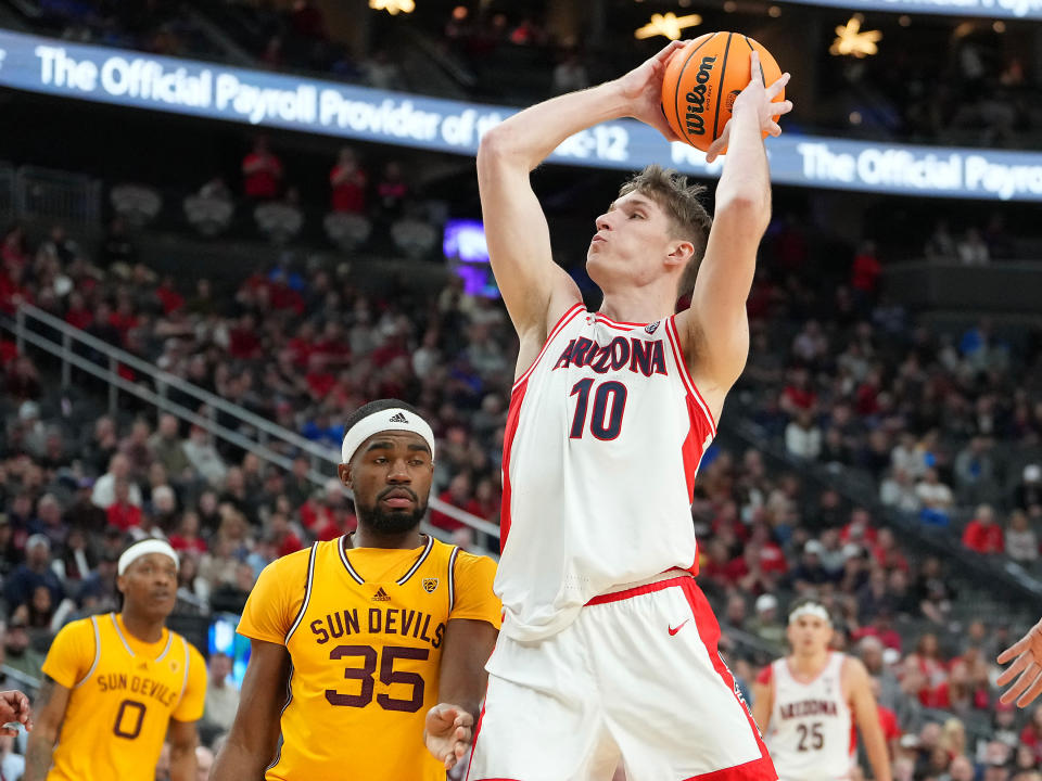 Arizona forward Azuolas Tubelis shoots over Arizona State guard Devan Cambridge during a game last month. (Stephen R. Sylvanie/USA TODAY Sports)