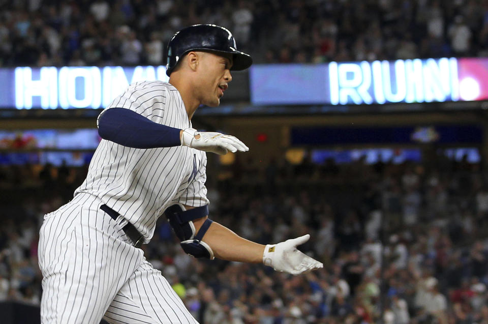 New York Yankees' Giancarlo Stanton rounds third base after he hit a two-run home run during the third inning against the Detroit Tigers in a baseball game Thursday, Aug. 30, 2018, at Yankee Stadium in New York. It was Stanton's 300th career home run. (AP Photo/Rich Schultz)