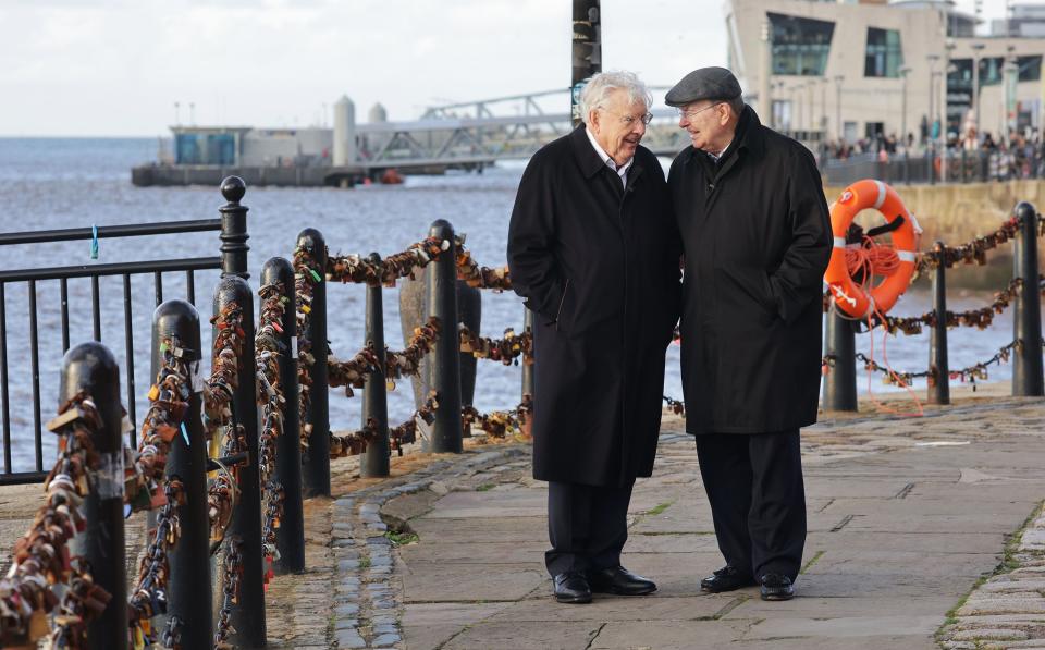 President M. Russell Ballard and Elder Quentin L. Cook walk along the Royal Albert Dock Liverpool in Liverpool.