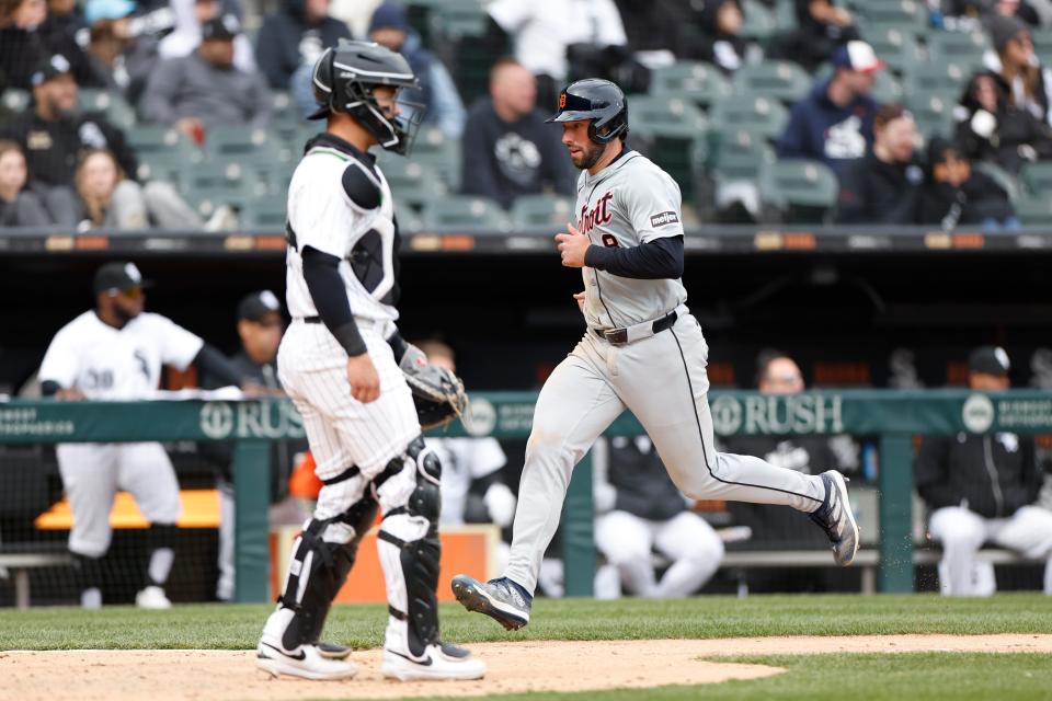 Detroit Tigers right fielder Matt Vierling scores against the Chicago White Sox during the ninth inning at Guaranteed Rate Field in Chicago, Illinois on Sunday, March 31, 2024.