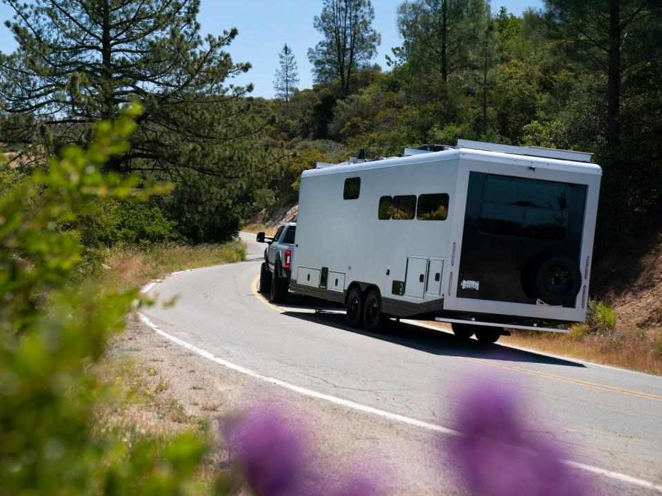 The travel trailer on the road.