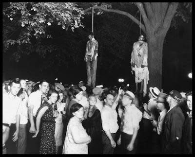 Thomas Shipp and Abram Smith, both of whom were African American, were lynched by a mob in Marion, Ind., in 1930. <a href="https://www.gettyimages.com/detail/news-photo/the-lynching-of-african-americans-thomas-shipp-and-abram-news-photo/871633440?adppopup=true" rel="nofollow noopener" target="_blank" data-ylk="slk:Photo 12/Universal Images Group via Getty Images;elm:context_link;itc:0;sec:content-canvas" class="link ">Photo 12/Universal Images Group via Getty Images</a>