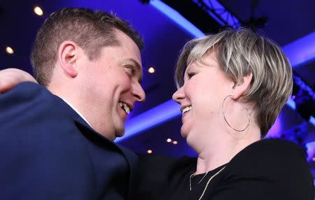 Andrew Scheer and his wife Jill hug after winning the leadership during the Conservative Party of Canada leadership convention in Toronto, Ontario, Canada May 27, 2017. REUTERS/Chris Helgren