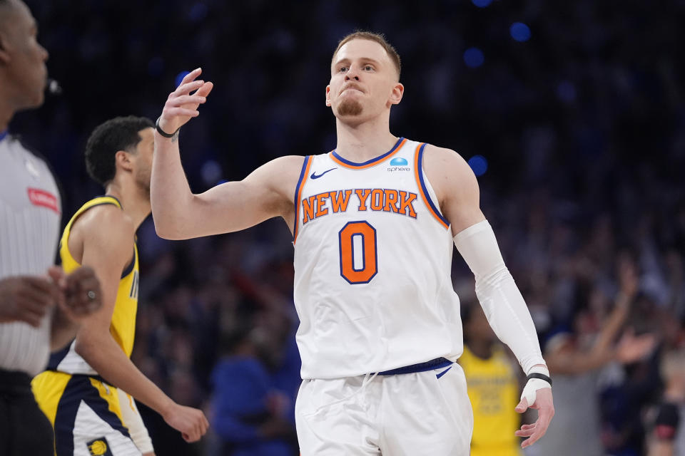 New York Knicks' Donte DiVincenzo (0) gestures after making a 3-point basket during the second half of Game 1 in an NBA basketball second-round playoff series against the Indiana Pacers, Monday, May 6, 2024, in New York. (AP Photo/Frank Franklin II)