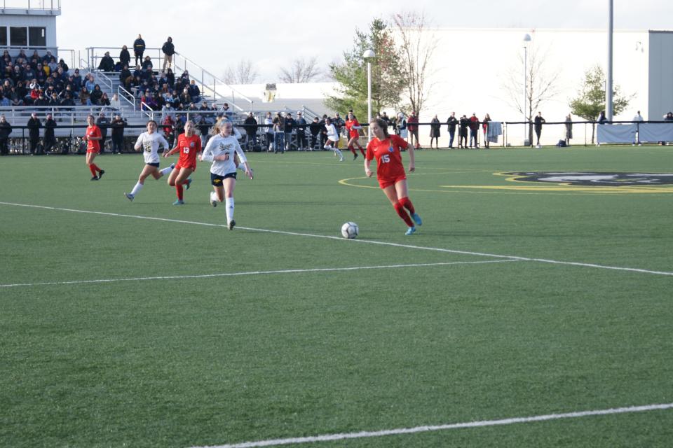 New Hartford senior Anna Rayhill moves the ball vs Section V's Spencerport on November 12, 2022, at the Class A Girls Soccer New York State Semifinals in Cortland, NY. The Spartans defeated the Rangers 1-1 (6-5) in Penalty Kicks