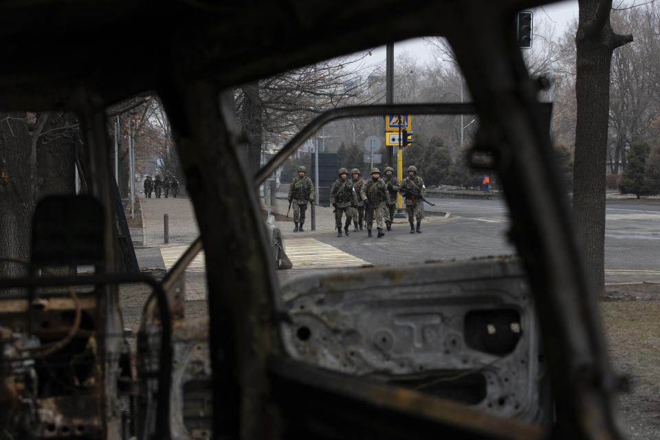 FILE - Soldiers patrol a street near the central square blocked by Kazakhstan troops and police in Almaty, Kazakhstan, Monday, Jan. 10, 2022. The government, by then led by Nazarbayev's close ally Tokayev, responded with a deadly clampdown, culminating in a "shoot-to-kill" order as the president blamed "terrorists" allegedly funded and trained from abroad. (AP Photo/Vasily Krestyaninov, File)