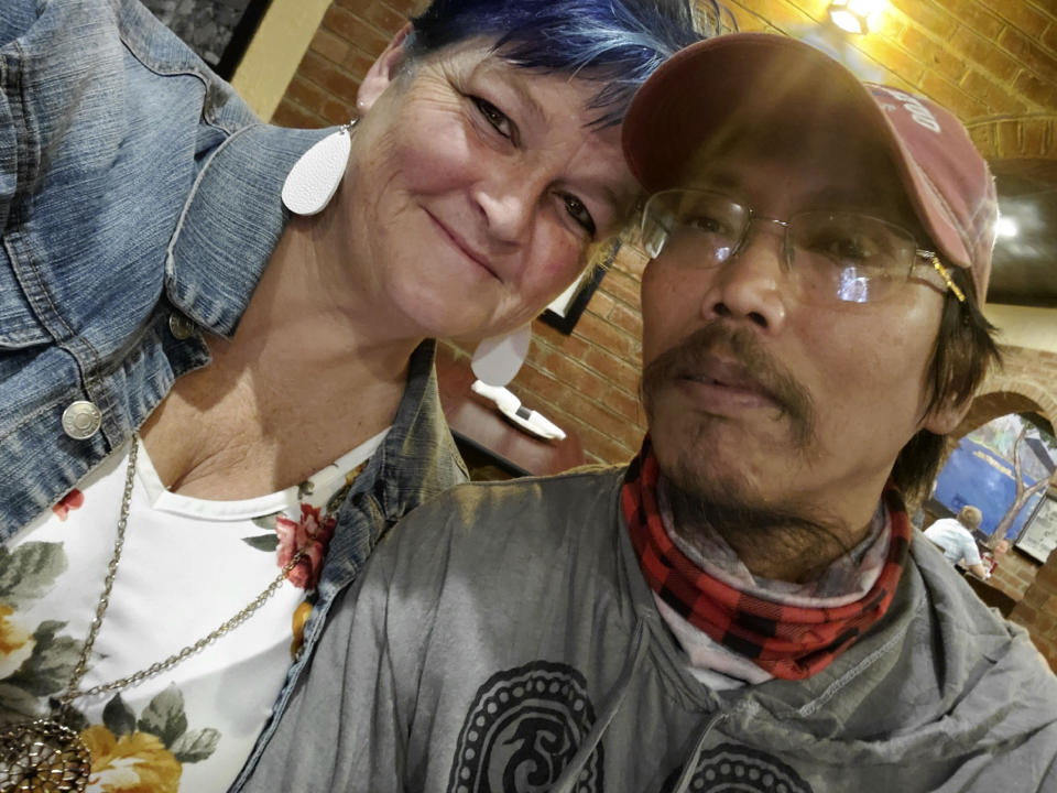 In this Sunday, Oct. 4, 2020, photo, Debra Ferrell and her husband, Jun-Jun, take a photo together on her 53rd birthday in Roanoke, Va. Ferrell's family couldn't gather to celebrate the day due to the pandemic, so she decided to give back with 53 acts of kindness for people across the country. (Debra DC Ferrell via AP)