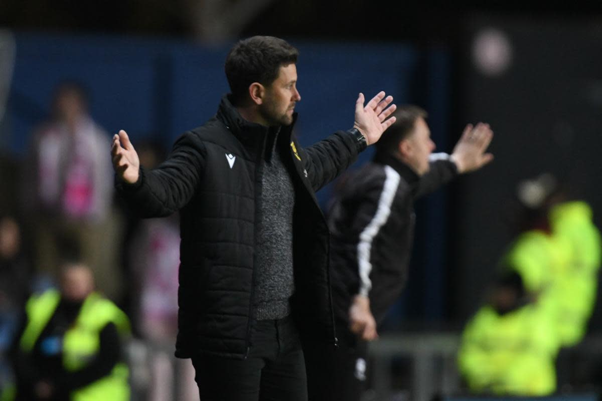 Oxford United head coach Des Buckingham cuts a frustrated figure on the touchline <i>(Image: Mike Allen)</i>