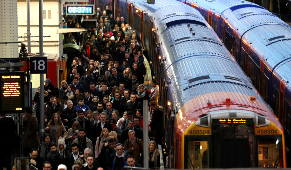 On the day that rail fares increase, passengers arrive at Waterloo Station in London (REUTERS/Peter Nicholls)