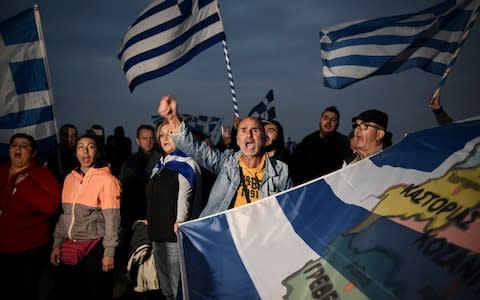 Greek protesters chant slogans against the name change deal during a rally in the Greek city of Thessaloniki, as Macedonians went to the polls - Credit: Giannis Papanikos/AP