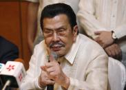 Manila Mayor Joseph Estrada speaks during a news conference in Hong Kong Wednesday, April 23, 2014. Hong Kong and the Philippines reached a compromise Wednesday over Hong Kong's demands for an apology for the families of eight tourists killed in a bungled response to a 2010 Manila hostage-taking that soured relations. (AP Photo/Kin Cheung)