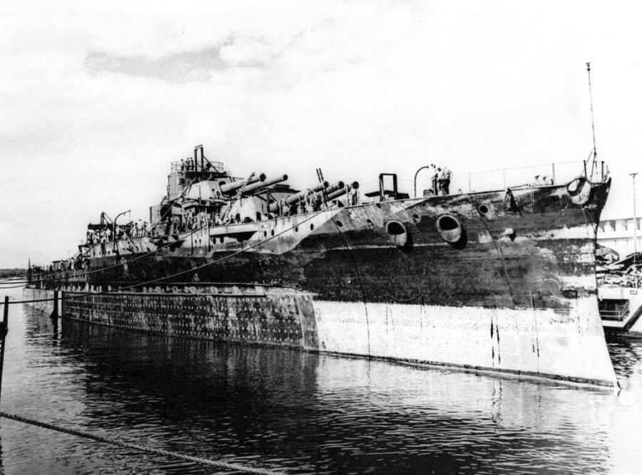 FILE – In this Nov. 27, 1944 file photo, the wreckage of the USS Oklahoma leaves Pearl Harbor drydock in Hawaii. It was sunk in the Dec. 7, 1941 Japanese attack. (AP Photo)