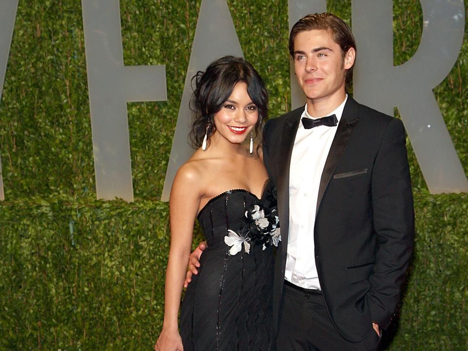 Vanessa Hudgens and Zac Efron pose at a Vanity Fair party.