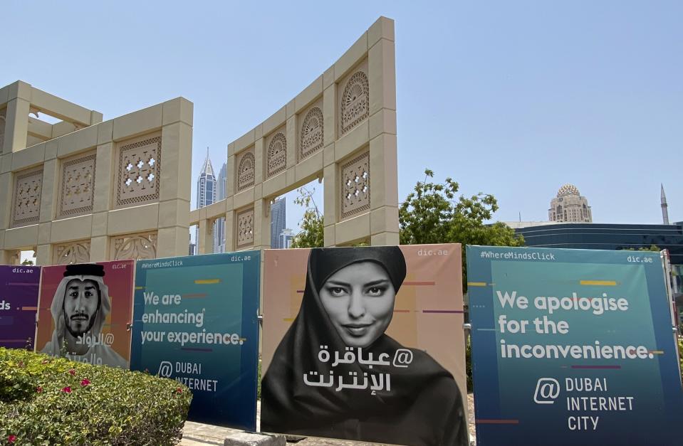 Advertising billboards are displayed at the Dubai Internet City in Dubai, United Arab Emirates, Thursday, June 9, 2022. The TECOM Group, whose 10 holdings include Dubai Internet City and Dubai Media City, and is a major free zone operator in Dubai owned by the sheikhdom's ruler said Thursday it would make an initial public offering on the local stock market, the latest state asset to list in an effort to boost the city-state's bourse. (AP Photo/Kamran Jebreili)
