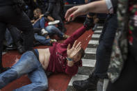 <p>People clash with Spanish police officers outside the Ramon Llull polling station in Barcelona Oct. 1, 2017 during a referendum on independence for Catalonia banned by Madrid. (Photo: Fabio Bucciarelli/AFP/Getty Images) </p>