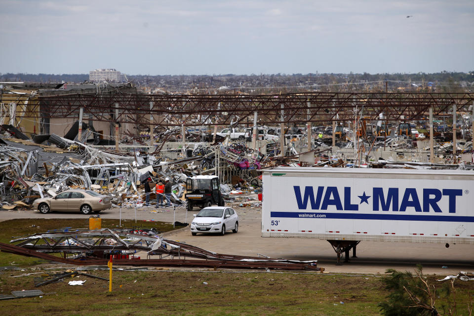 A destroyed Wal Mart is seen in the foreground with Saint John's Hospital in the distance in Joplin, Missouri May 26, 2011. The threat of a new tornado hitting Joplin passed by late on Tuesday. But a line of storms plowed through Oklahoma on Tuesday, where at least five people were killed and many more injured in tornadoes near Oklahoma City. Rescue and recovery teams scoured the wreckage of the small Midwestern city, which was devastated by a high-velocity whirl of wind that destroyed about 2,000 buildings. REUTERS/Eric Thayer (UNITED STATES - Tags: DISASTER ENVIRONMENT)