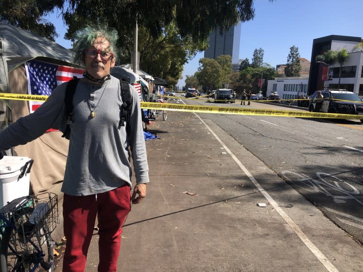 GemBob Brookhyser stands at a San Vincente Boulevard homeless encampment