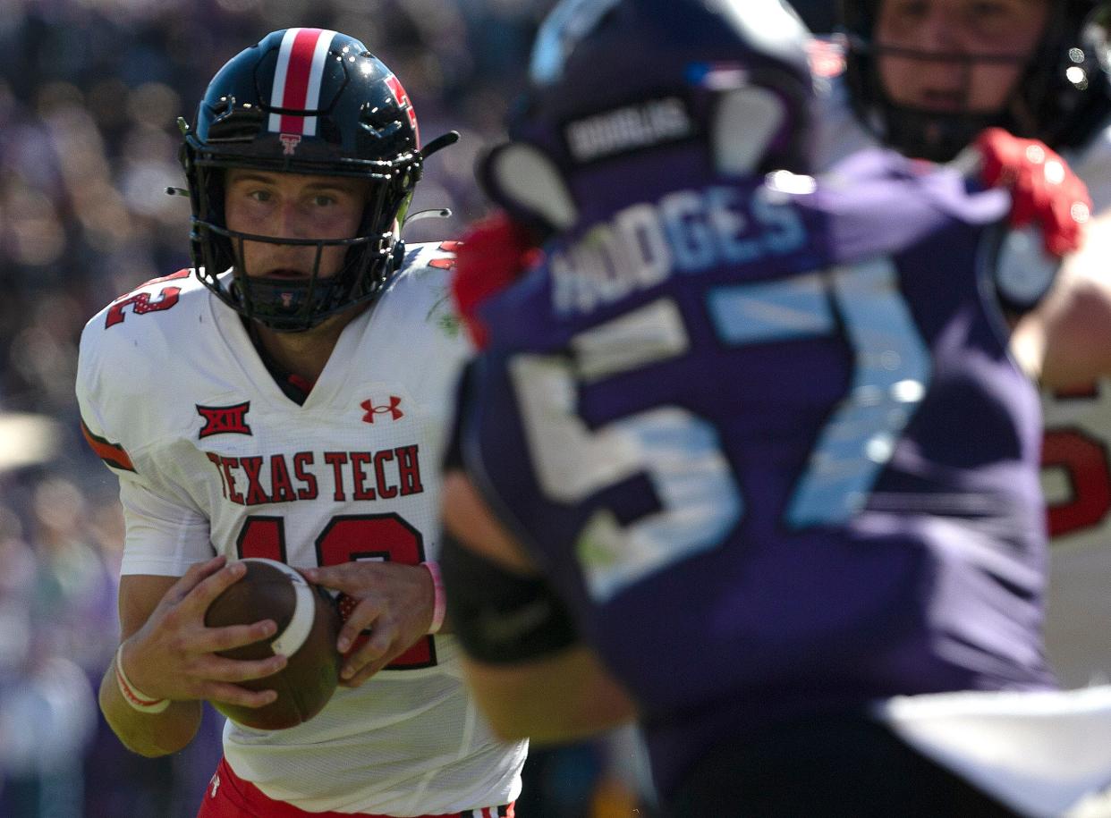 Texas Tech quarterback Tyler Shough, left, eyes TCU linebacker Johnny Hodges during the Red Raiders' 34-24 loss on Nov. 5 in Fort Worth. Legal staff from Tech and the Big 12 have both asked state Attorney General Ken Paxton to block release of communications between Tech and TCU pertaining to the game. Tech coach Joey McGuire said his staff sent "close to 12" questions pertaining to rules and officiating to the conference office after the game.