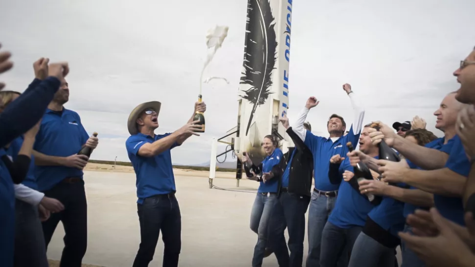 Jeff Bezos and co. pop open champagne bottles to celebrate their record-setting trip to space.