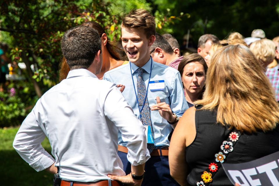Democratic presidential candidate Pete Buttigieg, mayor of South Bend, Indiana, talks with Nick Roberts, 19, of Indianapolis, at a campaign event, Wednesday, Aug. 14, 2019, at a home in Muscatine, Iowa. Roberts drove ten hours from Indiana to see Buttigieg, on his 19th birthday.