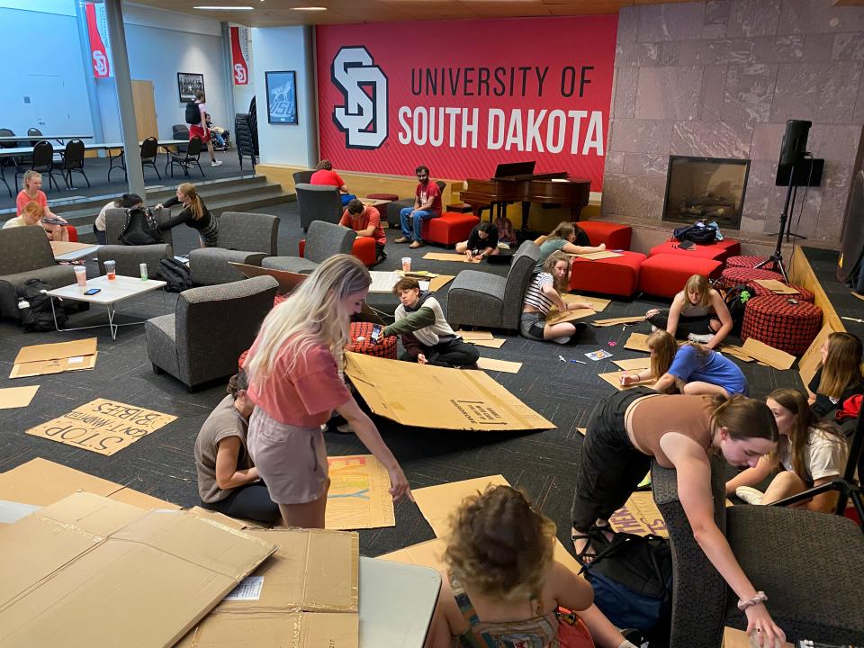 Preparing to march across the University of South Dakota’s campus to protest the state’s abortion ban, students made signs to communicate their feelings.