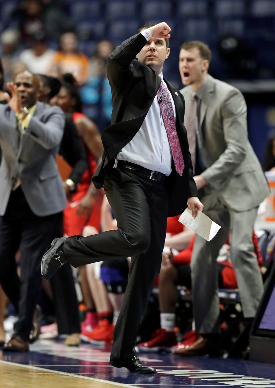 Mississippi coach Matt Insell celebrates a score against Missouri during the first half of an NCAA college basketball game at the women's Southeastern Conference tournament Thursday, March 1, 2018, in Nashville, Tenn. (AP Photo/Mark Humphrey)