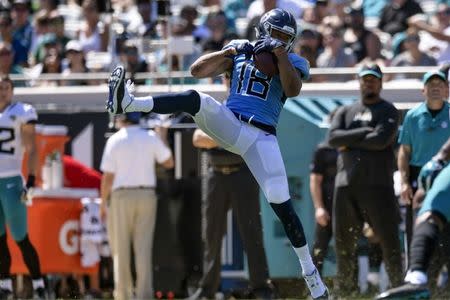 Sep 23, 2018; Jacksonville, FL, USA; Tennessee Titans wide receiver Rishard Matthews (18) catches the ball during the first half against the Jacksonville Jaguars at TIAA Bank Field. Mandatory Credit: Douglas DeFelice-USA TODAY Sports