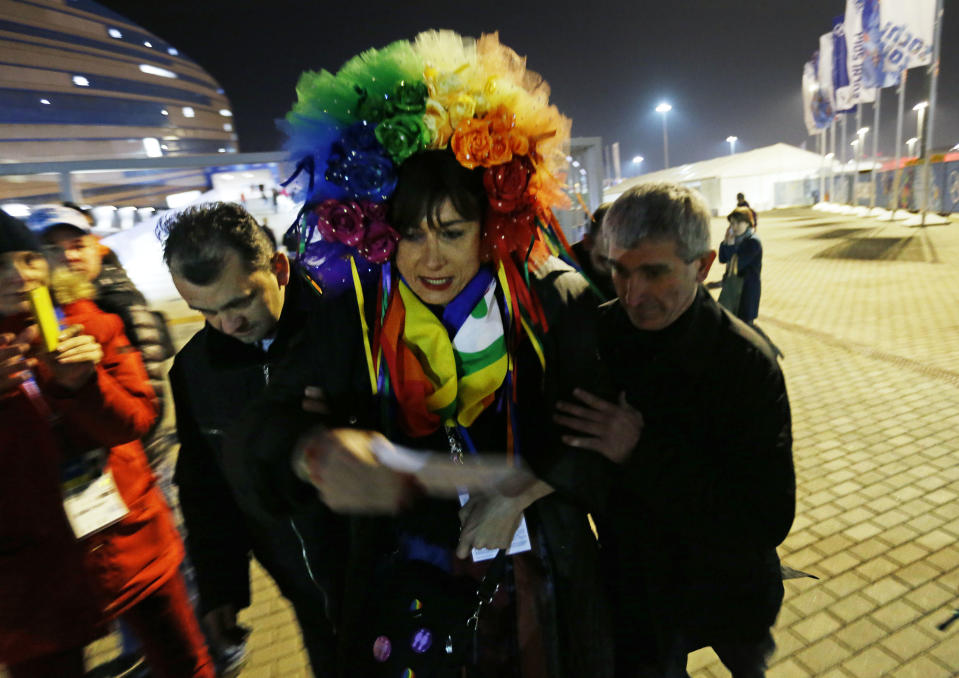 Vladimir Luxuria, a former Communist lawmaker in the Italian parliament and prominent crusader for transgender rights, is detained by police after entering the Shayba Arena at the 2014 Winter Olympics, Monday, Feb. 17, 2014, in Sochi, Russia. (AP Photo/David Goldman)