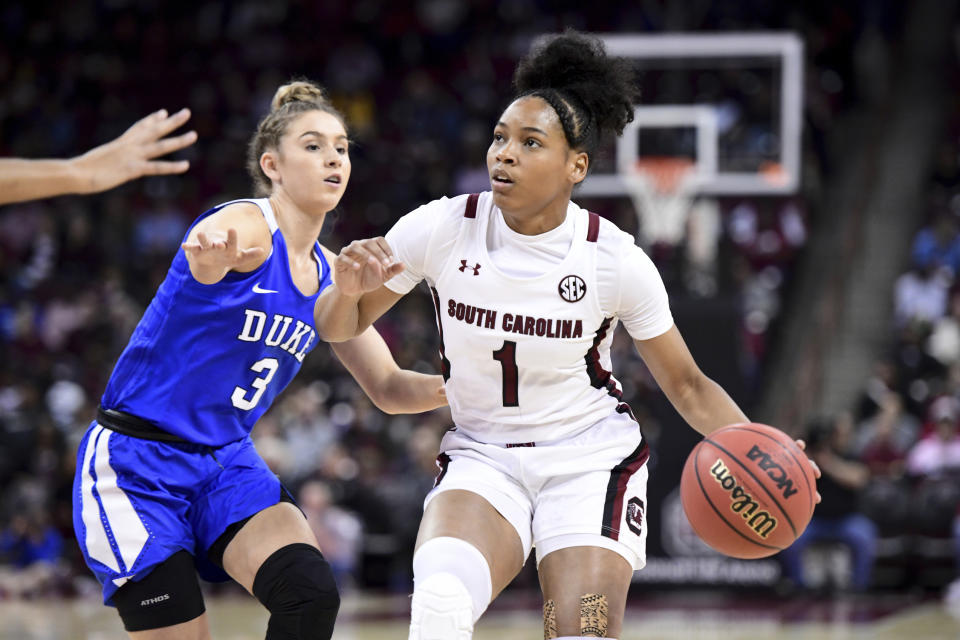 South Carolina guard Zia Cooke (1) dribbles the ball next to Duke guard Miela Goodchild (3) during the first half of an NCAA college basketball game Thursday, Dec. 19, 2019, in Columbia, S.C. (AP Photo/Sean Rayford)